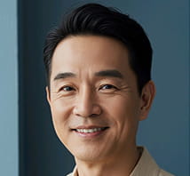Smiling Rezku team member professional portrait on a blue background
