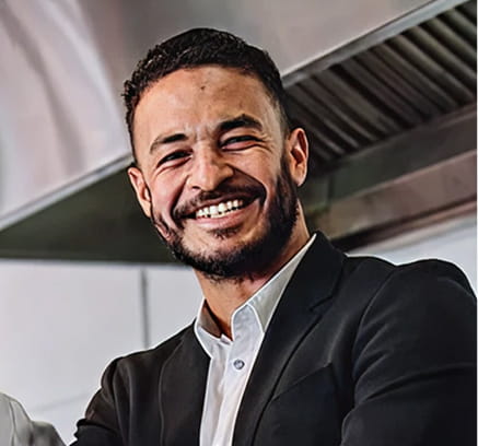 Restaurant professional smiling in a commercial kitchen